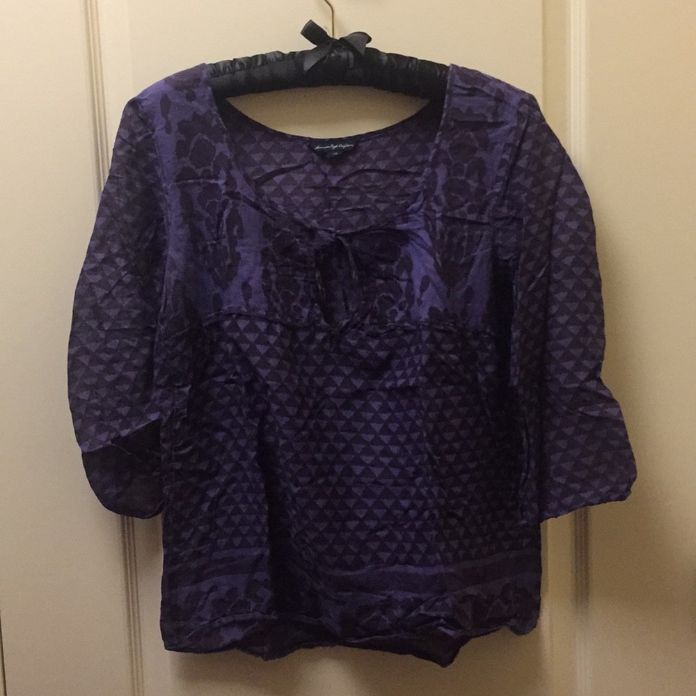 See through brown and purple blouse